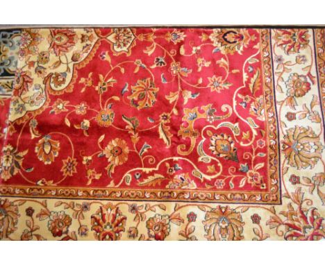 Red ground Kashan pattern machine carpet, 2.3m x 1.6m