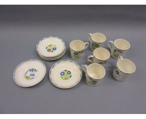 Set of six 1930's floral decorated coffee cans with saucers by Heal and Son in Country Bunch pattern