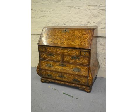 18th Century Dutch walnut floral marquetry inlaid bombe bureau, the fall front enclosing a fitted interior with well above fo