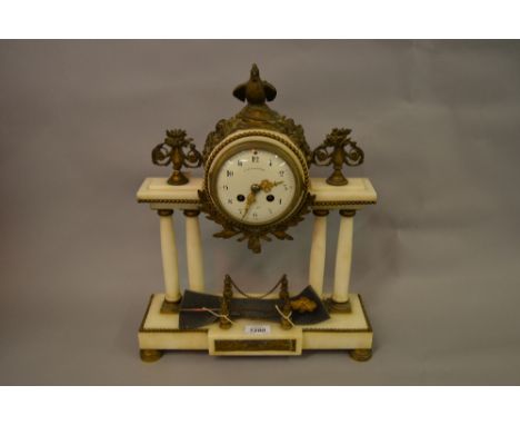 French white marble and ormolu mounted two train mantel clock, the white dial signed Courvoisier, Paris, within a drum head c