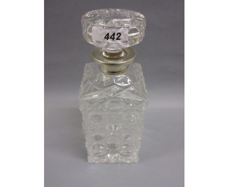 Square cut glass decanter with stopper having a silver collar