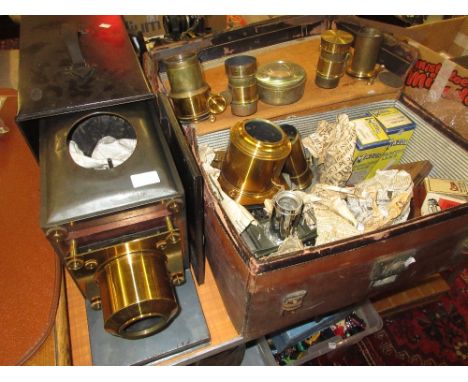Good quality gilt brass and black japanned magic lantern inscribed Broadhurst Clarkson, London, together with a leather case 
