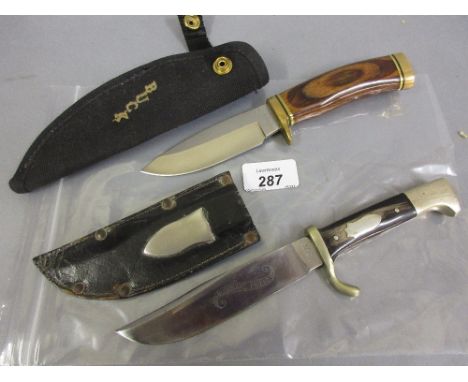 Small Bowie knife ' The Bushman's Friend ', with horn faced grip and original scabbard, the blade inscribed ' Merchant Prince