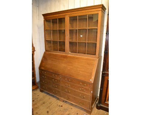 Large early 20th Century oak estate bureau bookcase with a moulded cornice above glazed doors, the fall front with fitted int