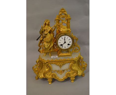 19th Century gilded spelter and alabaster figural mantel clock with a two train movement housed under a glass dome