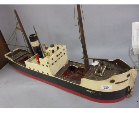 Lines Bros. for Triang wooden clock work model cargo ship, British Merchant CONDITION REPORT This is made of wood as stated i