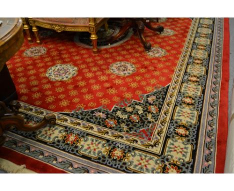 Good quality Chinese carpet with a medallion design on a red ground with borders, 12ft x 9ft approximately CONDITION REPORT G