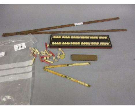 Antique ivory folding rule, brass and steel plumber's gauge, cribbage board, box and rule and sundries