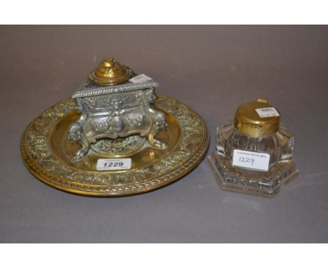 Circular brass and spelter inkwell together with a hexagonal glass inkwell with brass cover