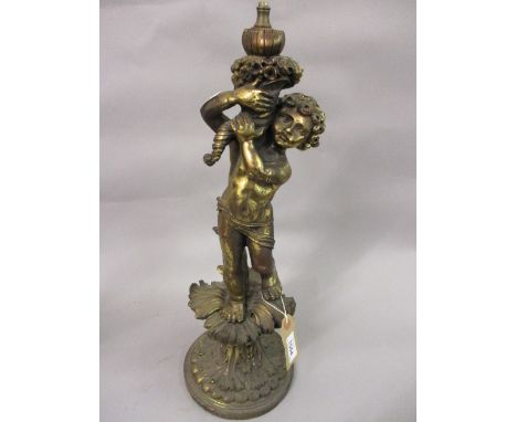 Gilt metal lamp base in the form of putto, Chinese carved hardwood lamp base, an artists materials box and a mahogany candles