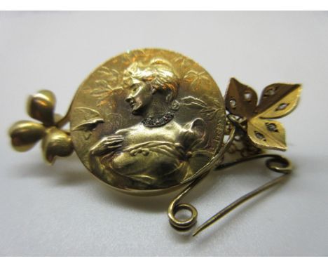 Continental yellow metal and diamond chip set brooch, the circular centre panel decorated in relief with a portrait of a lady