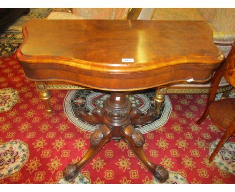 19th Century walnut serpentine fronted card table, the fold-over top with baize lined interior on turned central column and s