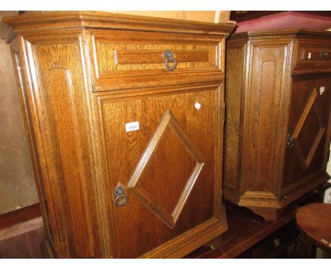 Pair of 20th Century oak side cabinets having single drawer and single panel door on bracket feet