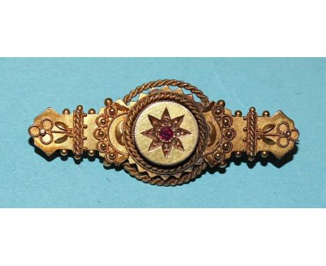 A 15ct gold cannetile brooch set ruby and rose-cut diamond points, 46mm long, 4.9g. 