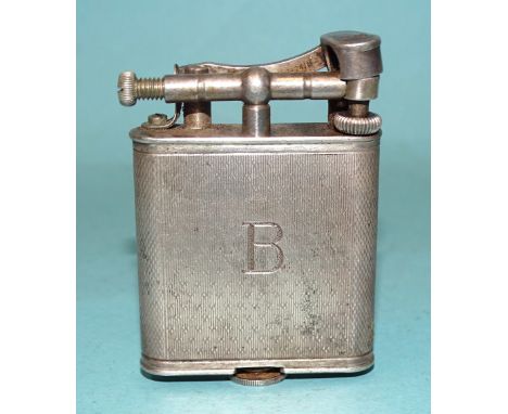 A hallmarked silver Dunhill lighter with engine-turned body, London 1928, Pat. no.390107, (a/f, fuel screw cross-threaded). 