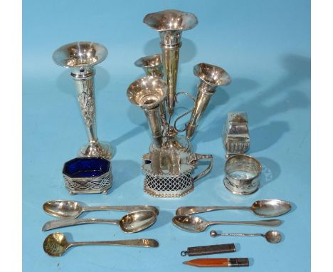 A small silver four-fluted epergne on loaded base, 17cm high, Birmingham 1912, a silver spill vase with loaded base, 14cm hig