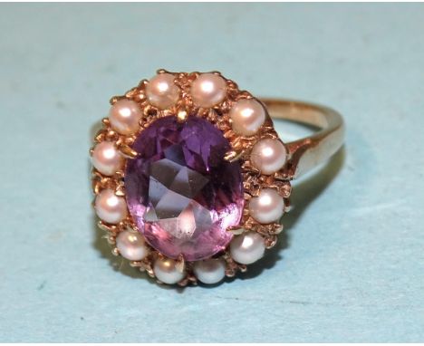 An amethyst and seed pearl cluster ring on unmarked gold mount, size L½, 3.4g. 