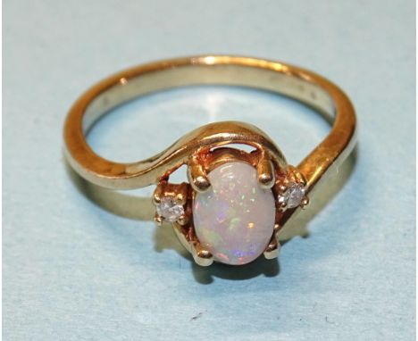 A 9ct gold crossover ring set opal and two 8/8-cut diamond points, size K, 2.2g. 