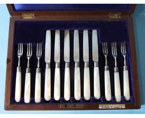A set of six fruit knives and forks with mother-of-pearl handles, in fitted case, for Carrington &amp; Co. Ltd. 