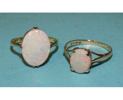 A 14k gold ring set opal, size K, 1.5g and another, 9ct gold example, size L, 1.3g, (2). 