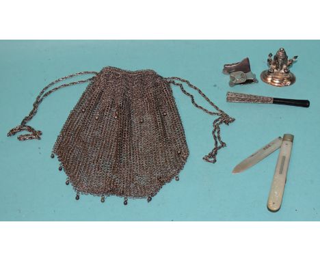 A silver-bladed mother-of-pearl fruit knife, a chain mail purse, (a/f), an unmarked white metal and Bakelite cigarette holder