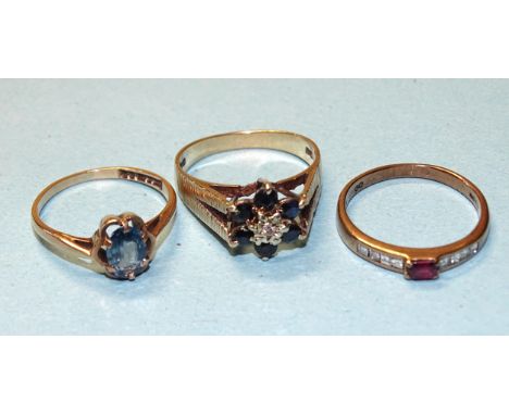 A 9ct gold ring set ruby between eight square-cut diamonds, size L½ and two other 9ct gold gem-set rings, sizes L and M, gros