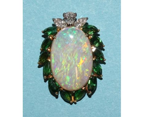 An opal, chrome diopside and diamond pendant claw-set an opal cabochon within surround of one pear-shaped and two marquise-cu