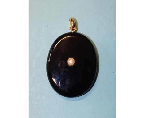 A Victorian oval onyx locket set a single demi-pearl, (chip below loop), 50 x 39mm, 23.9g. 