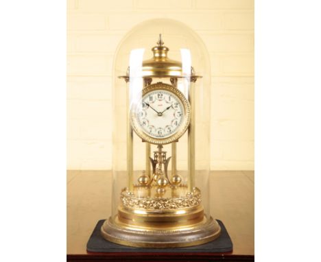 A GILT BRASS ANNIVERSARY CLOCK BY KIENINGER AND OBERGFELLwith four-hundred day movement, the enamel dial with Arabic numerals