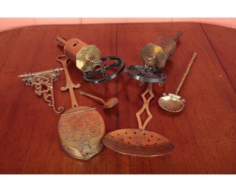A COLLECTION OF BRASS COOKING UTENSILSVictorian and earlier, including scallop shell ladle, skimmer, a teardrop shaped spoon,