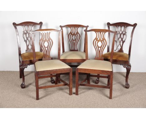 A PAIR OF GEORGE III CHIPPENDALE STYLE SIDE CHAIRS with cabriole legs on ball claw feet; together with three mahogany dinning