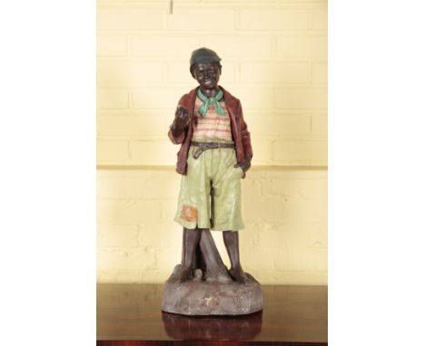 AN AUSTRIAN PAINTED TERRACOTTA FIGURE OF A BOY IN THE MANNER OF GOLDSCHEIDERdated 1885 and indistinctly marked to the reverse