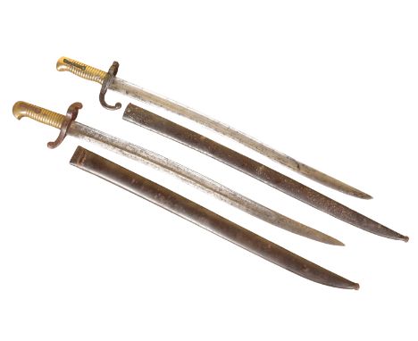 TWO WWI BAYONETSwith the original metal scabbards and brass ribbed grips, 71cm long (2)Note: You must be over 18 to purchase 