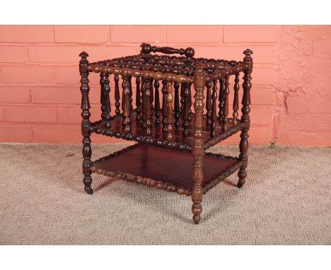 A VICTORIAN ROSEWOOD 'TURNER'S' CANTERBURYwith four divided compartments over a single shelf, on brass toes and castors, 47cm