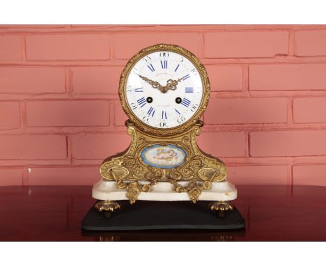 A FRENCH GILT METAL MANTEL CLOCK BY POTONIE OF PARIS19th century, the eight day movement striking on a bell, the enamel dial 