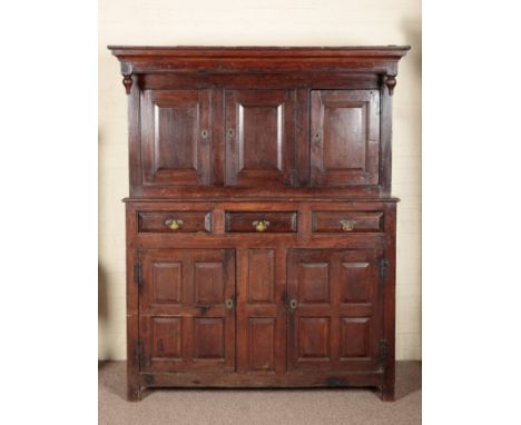 A WELSH OAK COURT CUPBOARD OR DUODARN18th century, the upper section with panelled cupboards, the base with three drawers ove