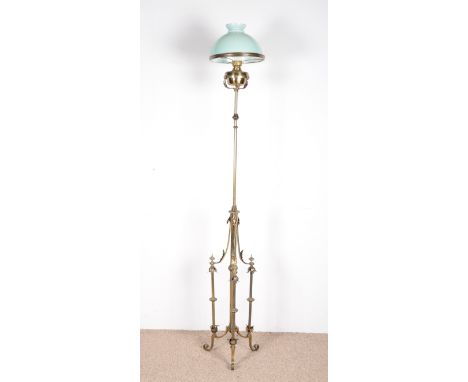 AN EDWARDIAN BRASS STANDARD LAMPwith oil lamp glass shade, 224cm high