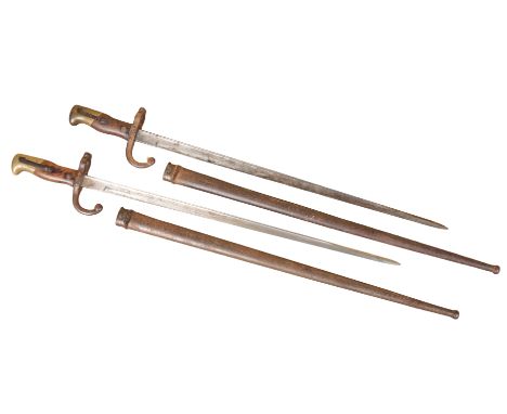 TWO FRENCH GRAS BAYONETS circa 1870, with original metal scabbards, 60cm long (2)Note: You must be over 18 to purchase this i