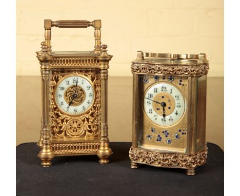 A FRENCH BRASS CARRIAGE CLOCKwith eight day movement, the dial with engraved flowers inset with jewels and an enamel chapter 