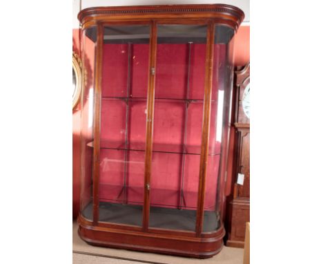 A LARGE EDWARDIAN MAHOGANY SHOP DISPLAY CABINET the dentil moulded cornice over glazed doors opening to a shelved interior, 2