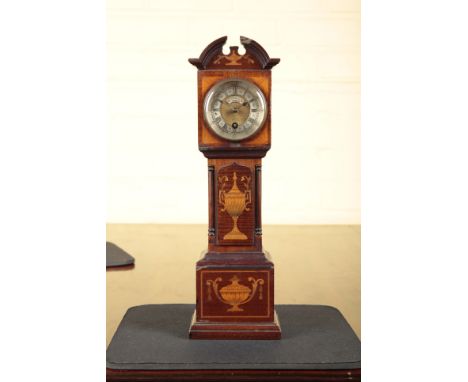 A MINIATURE LONGCASE CLOCK STAND19th century, the timepiece by W. Thornhill and Co., London, the case finely inlaid with urns