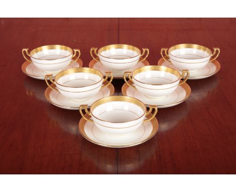 A SET OF SIX MINTON TWO-HANDLED CUPS AND SAUCERSmarked to the base, with gilded rims, the saucers 14.5cm diameter, the cups 6
