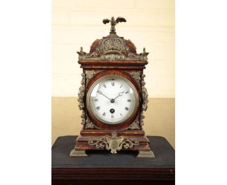 A VICTORIAN OAK AND BRASS MOUNTED MANTEL CLOCKwith an eight day movement, the enamel dial with Roman numerals and Arabic minu
