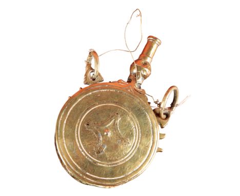 AN EASTERN BRASS POWDER FLASK 19th century, with engraved decoration, 17cm long