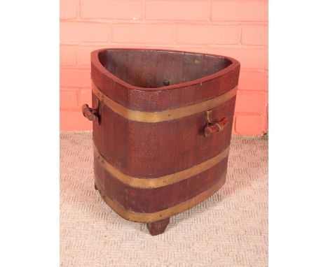 AN EDWARDIAN TEAK AND BRASS BOUND TRIFORM PLANTER BY CHAMPION & CO, LONDONstamped with makers marks and serial number to the 