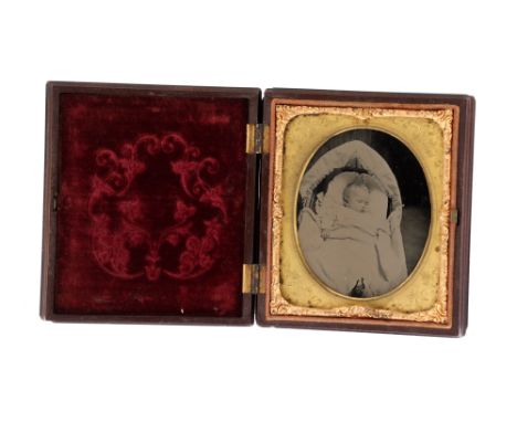 Post-Mortem Ambrotype of a Baby, the image of a baby, most likely post-mortem, in a crib, the image in a union case, case mea