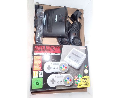 Super Nintendo Classic mini console with extension leads and a Sega Megadrive Arcade Classic console