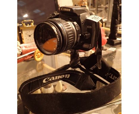 Canon EOS 400D digital camera on tripod