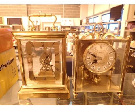 Koma lantern style brass anniversary clock and Kundo quartz skeleton clock with chime