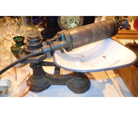 Cast iron balance scales with weights and a grease gun
